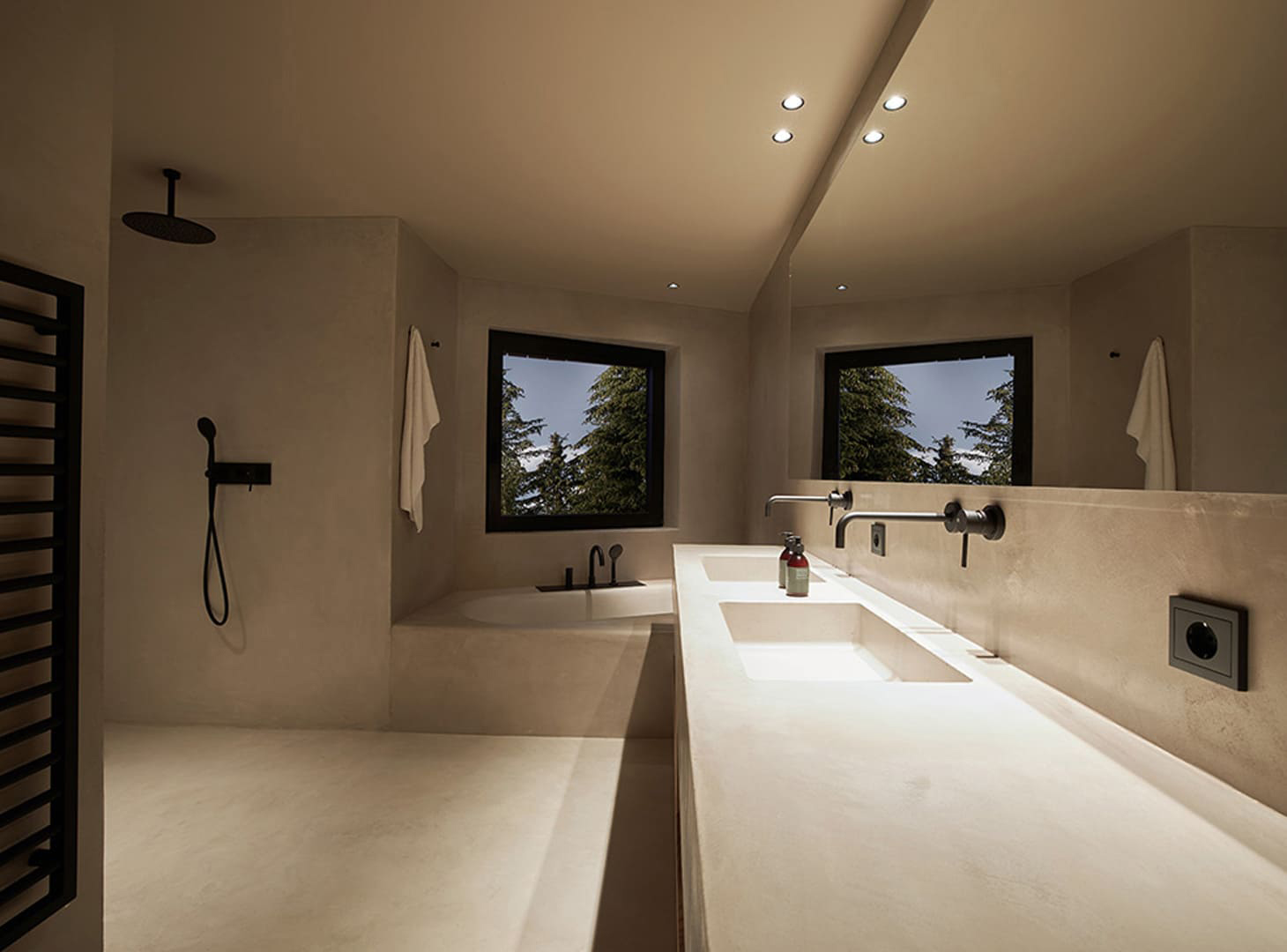 Stijlvoorbeeld microcement badkamer bad en wastafel in betonlook