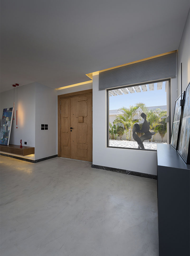 Stijlvoorbeeld microcement entree hal naadloos wand en vloer